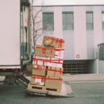 brown cardboard boxes on gray asphalt road