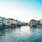 body of water between buildings under blue sky during daytime