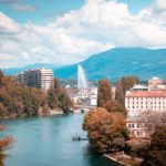body of water near trees and buildings during daytime